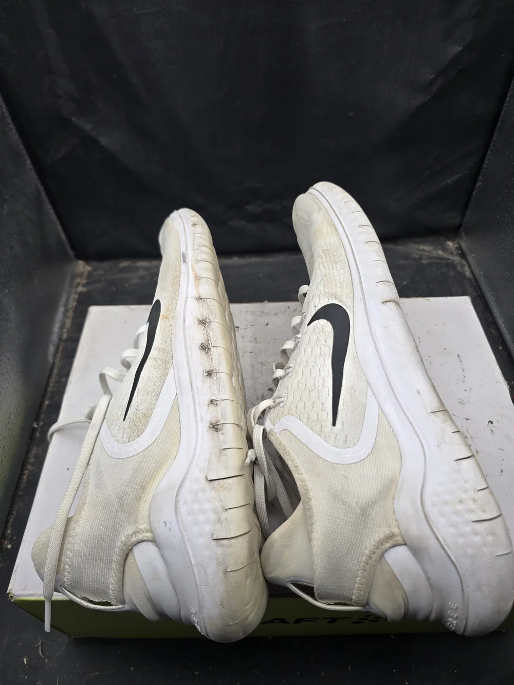 Nike White Athletic Running Shoes with Black Swoosh and Orange Insole